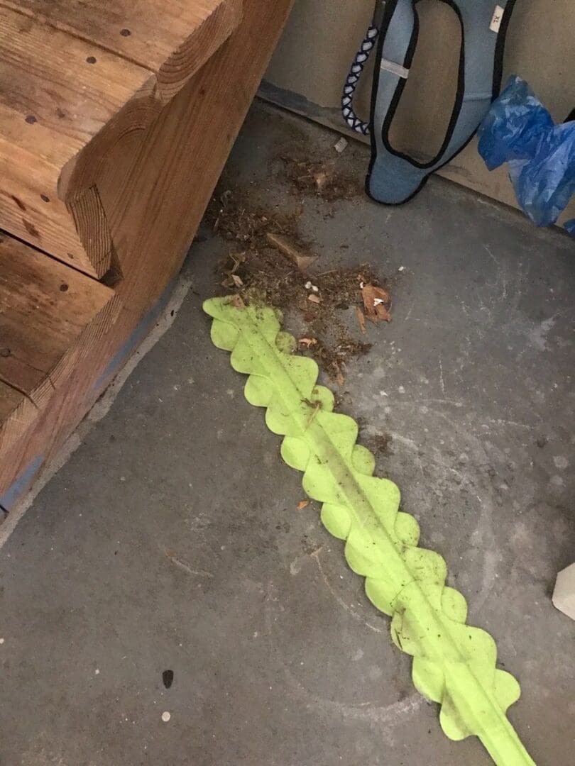 ask cindy shop green duster cleaning debris from under a staircase